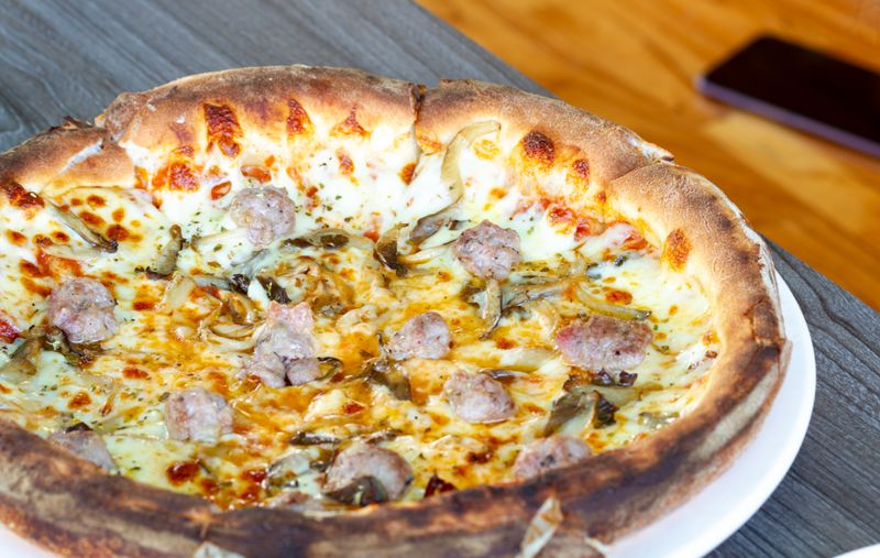 Sausage and mushroom pizza with golden crust