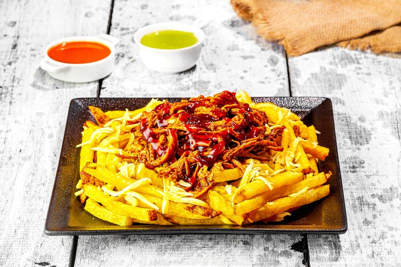 Loaded fries with cheese sauce and toppings